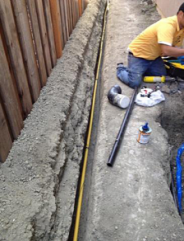 a Vacaville irrigation repair tech is installing a new sprinkler system