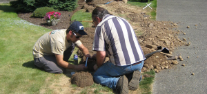 our sprinkler repairs in Vacaville techs are fixing a broken sprinkler